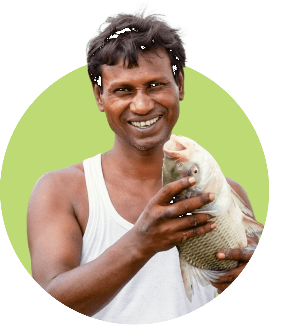 Farmer holding a freshly caught fish